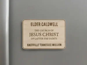 Laser-engraved maple wood LDS missionary name tag fridge magnet with custom mission name.